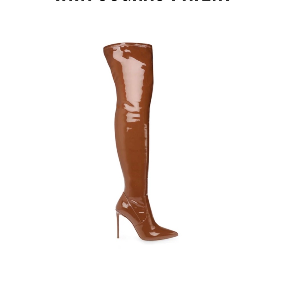 Gently worn, patent thigh high boot.